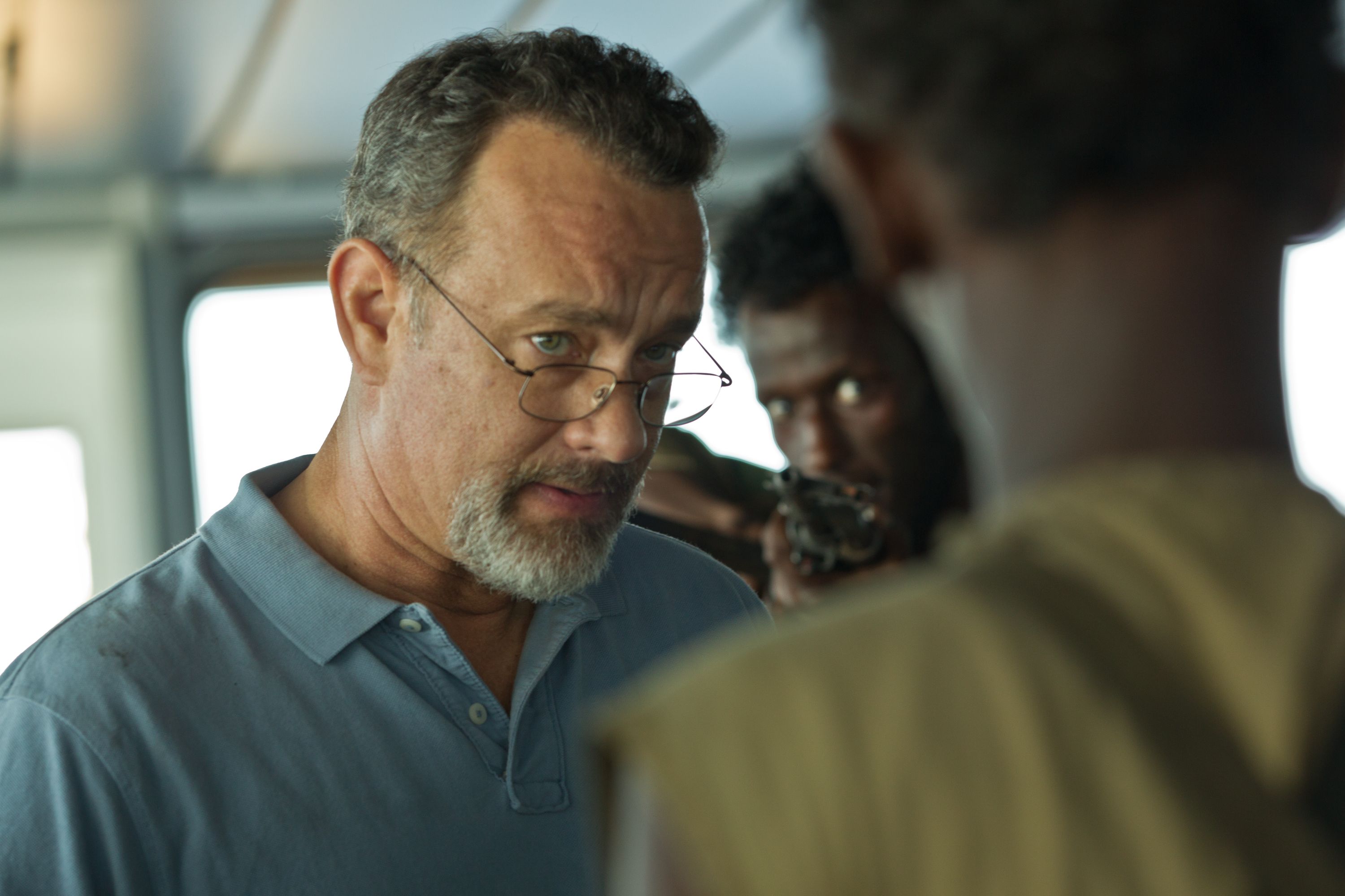 ... the young Bilal (Barkhad Abdirahman), and the volatile Najee (Faysal Ahmed). We also see the authorities who were drawn in to manage the situation. - captain-phillips-tom-hanks-4